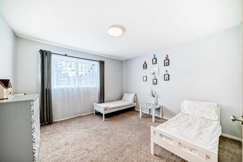 103 Everstone Place Sw, Calgary, AB - Indoor Photo Showing Bedroom