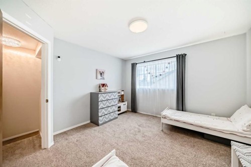 103 Everstone Place Sw, Calgary, AB - Indoor Photo Showing Bedroom