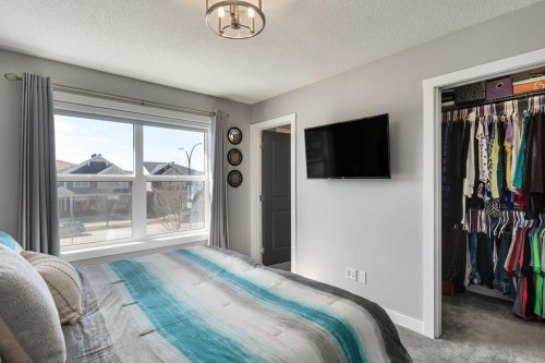 144 Wolf Willow Boulevard Se, Calgary, AB - Indoor Photo Showing Bedroom