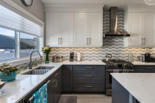 144 Wolf Willow Boulevard Se, Calgary, AB - Indoor Photo Showing Kitchen With Double Sink With Upgraded Kitchen
