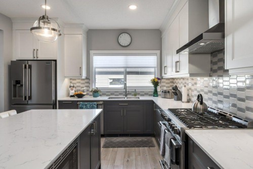 144 Wolf Willow Boulevard Se, Calgary, AB - Indoor Photo Showing Kitchen With Stainless Steel Kitchen With Double Sink With Upgraded Kitchen