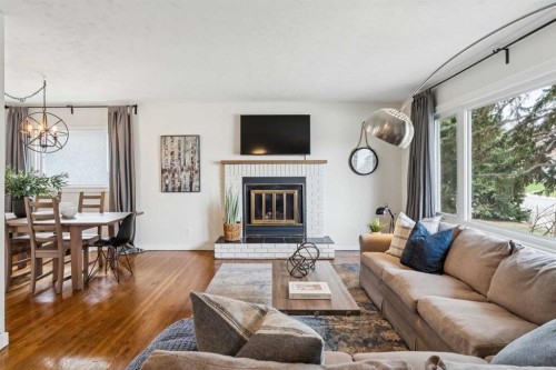 19 Hyslop Drive Sw, Calgary, AB - Indoor Photo Showing Living Room With Fireplace