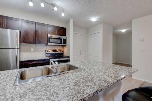 2125-81 Legacy Boulevard Se, Calgary, AB - Indoor Photo Showing Kitchen With Stainless Steel Kitchen With Double Sink With Upgraded Kitchen