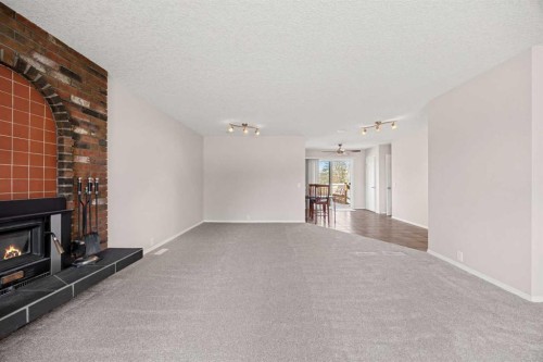 7720 Hunterquay Road Nw, Calgary, AB - Indoor With Fireplace