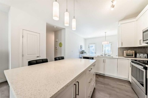 139 Legacy Point Se, Calgary, AB - Indoor Photo Showing Kitchen With Double Sink With Upgraded Kitchen