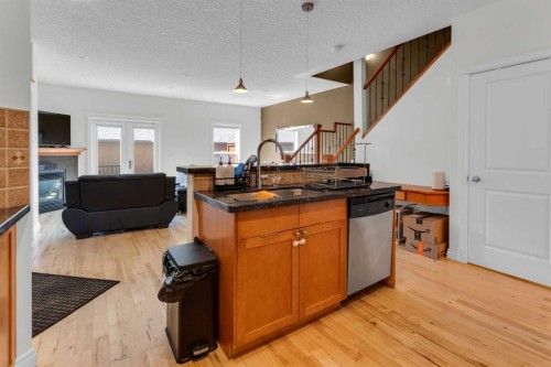 2-3421 5 Avenue Nw, Calgary, AB - Indoor With Fireplace