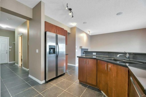 151 Everhollow Way Sw, Calgary, AB - Indoor Photo Showing Kitchen With Double Sink
