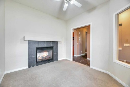 151 Everhollow Way Sw, Calgary, AB - Indoor Photo Showing Living Room With Fireplace