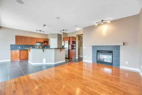 151 Everhollow Way Sw, Calgary, AB - Indoor With Fireplace