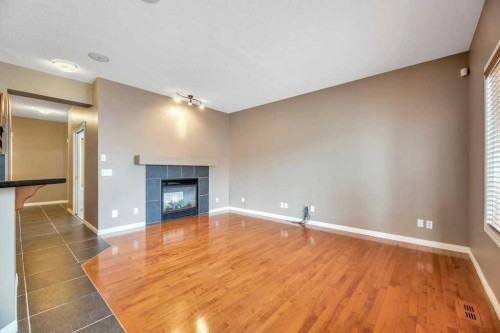 151 Everhollow Way Sw, Calgary, AB - Indoor With Fireplace