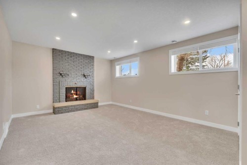 221 Madeira Crescent Ne, Calgary, AB - Indoor With Fireplace