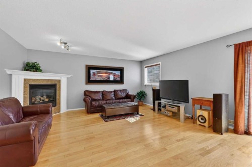 308 Cambridge Place, Strathmore, AB - Indoor Photo Showing Living Room With Fireplace