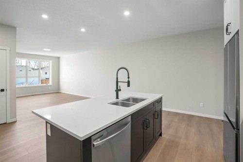 121 5 Avenue Se, High River, AB - Indoor Photo Showing Kitchen With Double Sink
