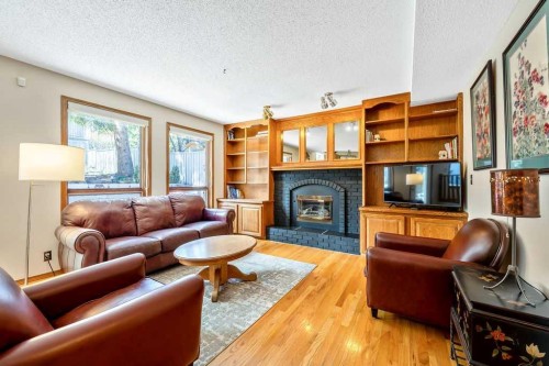 5019 Norris Road Nw, Calgary, AB - Indoor Photo Showing Living Room With Fireplace