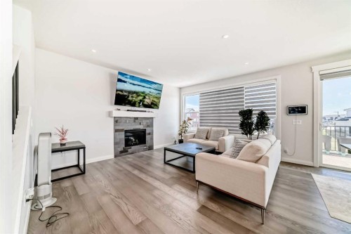 219 Chelsea Park, Chestermere, AB - Indoor Photo Showing Living Room With Fireplace
