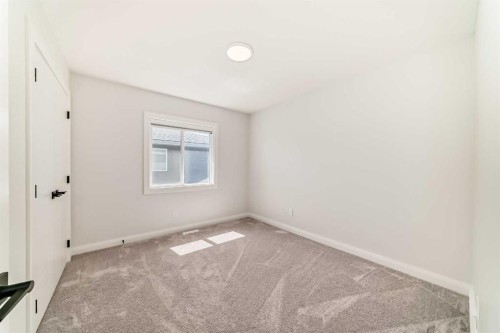 219 Chelsea Park, Chestermere, AB - Indoor Photo Showing Other Room