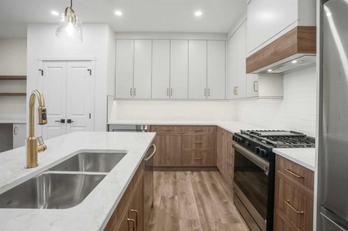 123 5 Avenue Se, High River, AB - Indoor Photo Showing Kitchen With Double Sink With Upgraded Kitchen