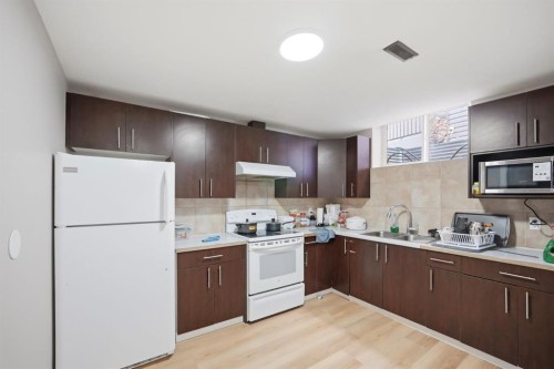 591 Taralake Way Ne, Calgary, AB - Indoor Photo Showing Kitchen With Double Sink