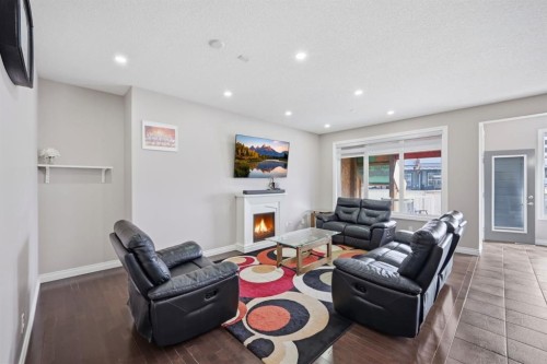 591 Taralake Way Ne, Calgary, AB - Indoor Photo Showing Living Room With Fireplace