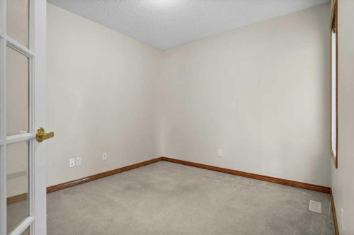 122 Rocky Ridge Villas Nw, Calgary, AB - Indoor Photo Showing Other Room