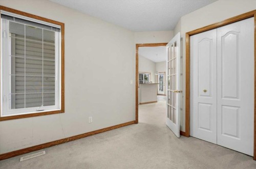 122 Rocky Ridge Villas Nw, Calgary, AB - Indoor Photo Showing Other Room