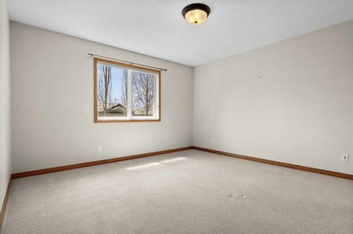 122 Rocky Ridge Villas Nw, Calgary, AB - Indoor Photo Showing Other Room