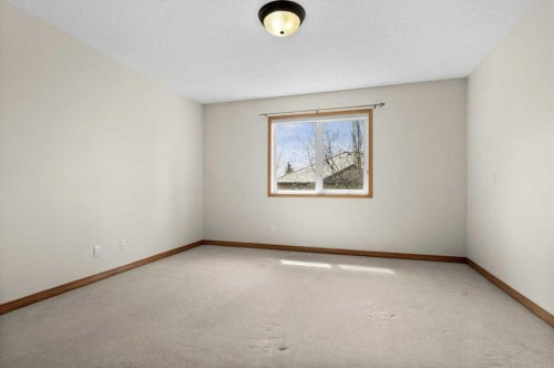 122 Rocky Ridge Villas Nw, Calgary, AB - Indoor Photo Showing Other Room