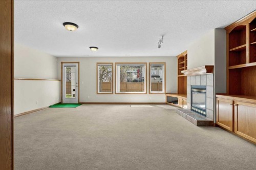 122 Rocky Ridge Villas Nw, Calgary, AB - Indoor With Fireplace