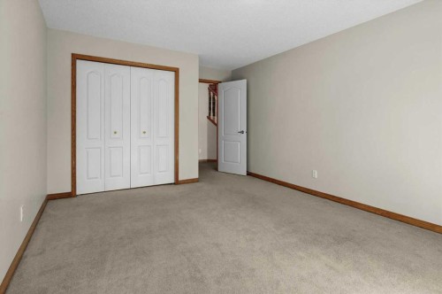 122 Rocky Ridge Villas Nw, Calgary, AB - Indoor Photo Showing Other Room