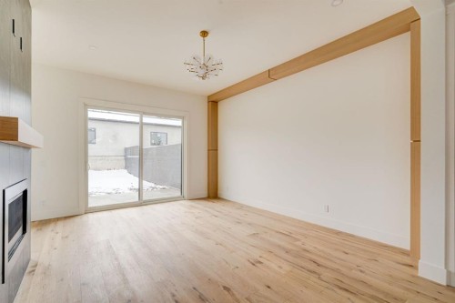 2447 29 Sw, Calgary, AB - Indoor Photo Showing Other Room With Fireplace