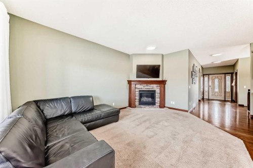 123 Parkmere Court, Chestermere, AB - Indoor Photo Showing Living Room With Fireplace