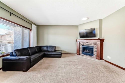 123 Parkmere Court, Chestermere, AB - Indoor Photo Showing Living Room With Fireplace