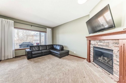123 Parkmere Court, Chestermere, AB - Indoor Photo Showing Living Room With Fireplace