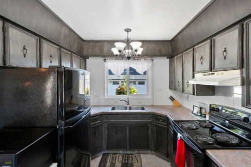 4417 55 Avenue, Olds, AB - Indoor Photo Showing Kitchen With Double Sink