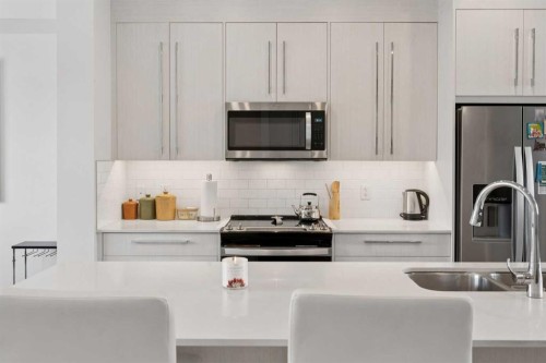 226 Dawson Way, Chestermere, AB - Indoor Photo Showing Kitchen With Double Sink With Upgraded Kitchen