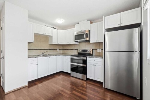 3405 35 Avenue Se, Calgary, AB - Indoor Photo Showing Kitchen With Stainless Steel Kitchen With Double Sink