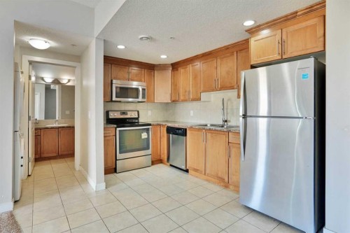 13-330 2Nd Street West, Brooks, AB - Indoor Photo Showing Kitchen With Stainless Steel Kitchen With Double Sink