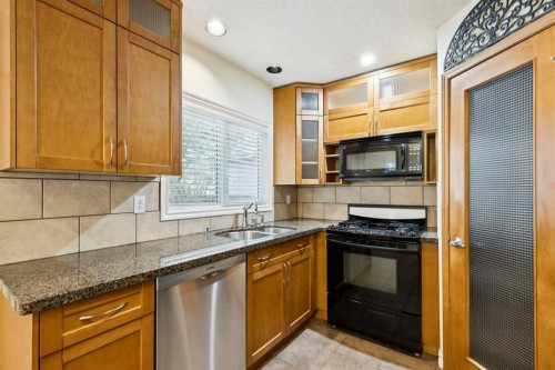 7615 36 Avenue Nw, Calgary, AB - Indoor Photo Showing Kitchen With Double Sink