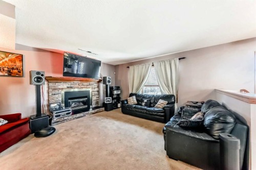 402 Citadel Hills Circle Nw, Calgary, AB - Indoor Photo Showing Living Room With Fireplace