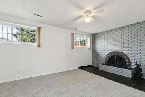 12 Huntwick Way Ne, Calgary, AB - Indoor With Fireplace