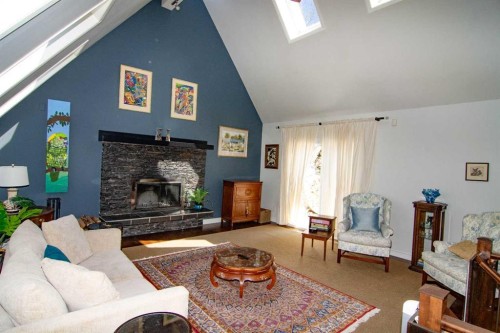 1616 Summer Street Sw, Calgary, AB - Indoor Photo Showing Living Room With Fireplace