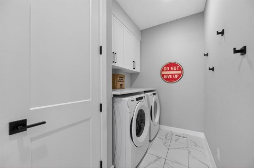 46 Crestridge Bay Sw, Calgary, AB - Indoor Photo Showing Laundry Room