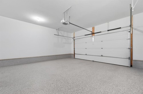 46 Crestridge Bay Sw, Calgary, AB - Indoor Photo Showing Garage