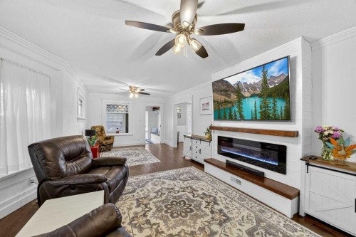 1919 14 Street, Didsbury, AB - Indoor Photo Showing Living Room With Fireplace