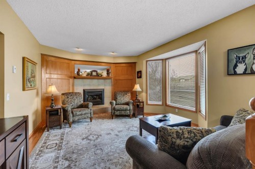 26 Tiller Place Se, Airdrie, AB - Indoor Photo Showing Living Room With Fireplace