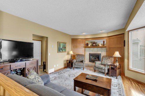 26 Tiller Place Se, Airdrie, AB - Indoor Photo Showing Living Room With Fireplace