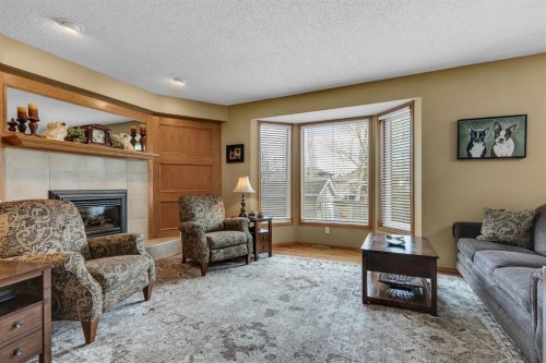 26 Tiller Place Se, Airdrie, AB - Indoor Photo Showing Living Room With Fireplace