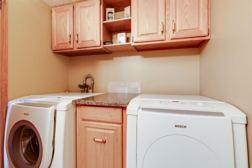 26 Tiller Place Se, Airdrie, AB - Indoor Photo Showing Laundry Room