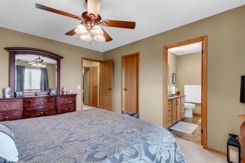26 Tiller Place Se, Airdrie, AB - Indoor Photo Showing Bedroom