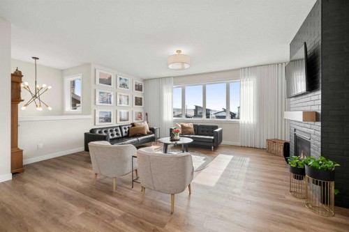 229 Precedence View, Cochrane, AB - Indoor Photo Showing Living Room With Fireplace